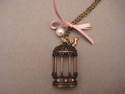 Sautoir chaine cage patine bronze...